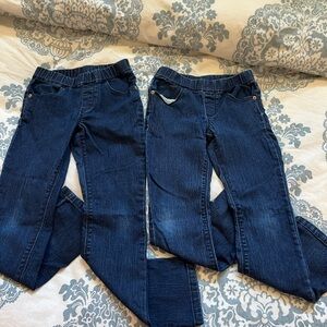 2 pairs of girls straight leg stretchy jeans.  Both size 7